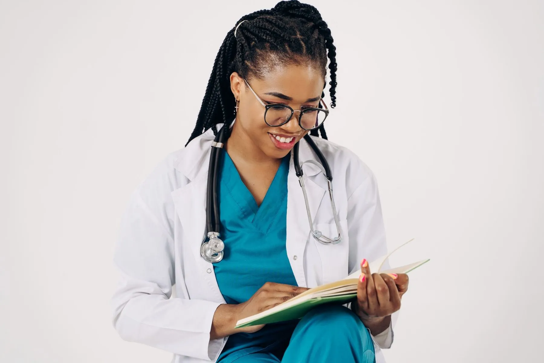 Smiling healthcare professional reviewing patient notes