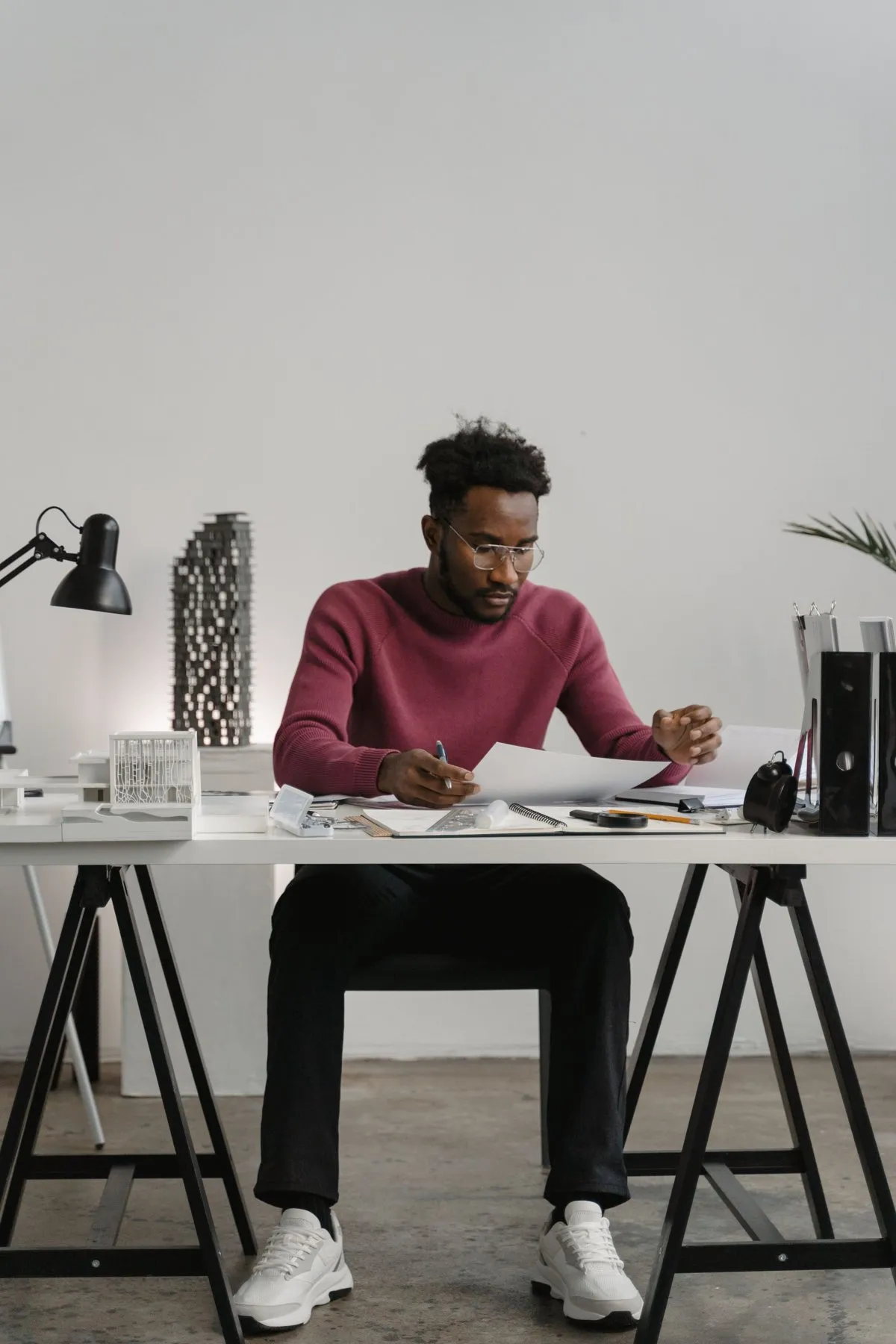 Executive reviewing documents at his desk