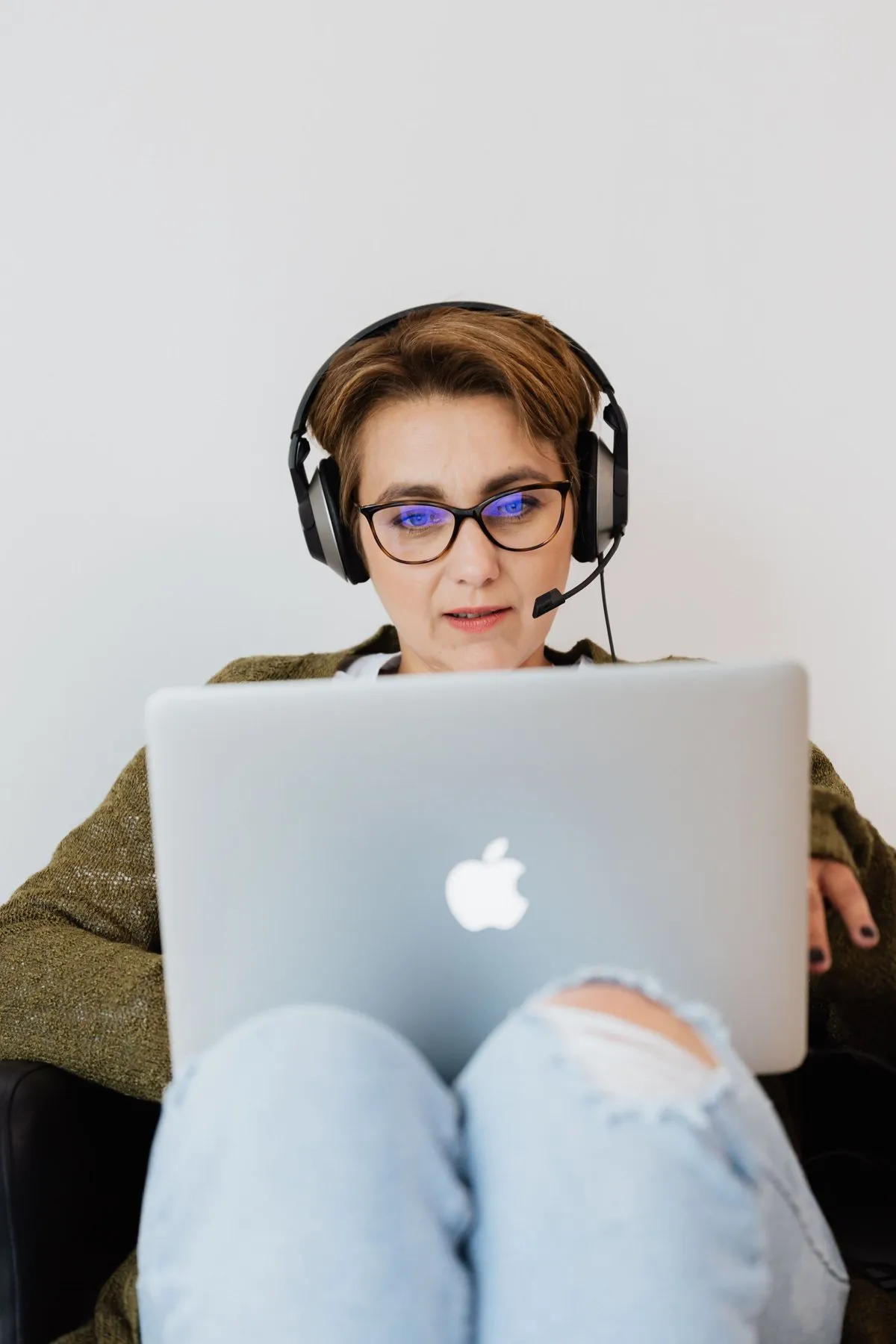Specialist with a headset working on a laptop